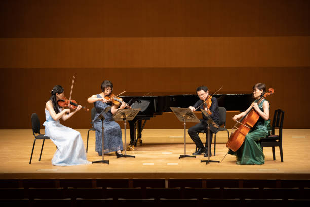 istock Group of musicians playing instruments at classical concert 1280342735