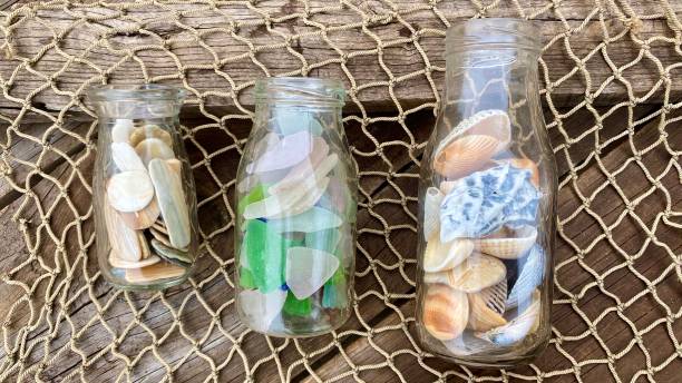 istock bottle of shells sea glass 1280342745
