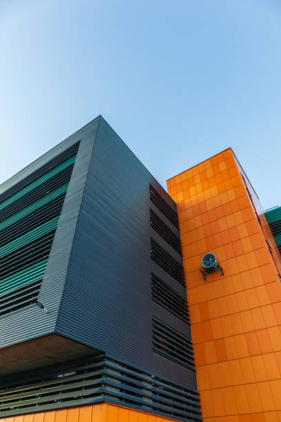 istock Building in architectural style high-tech bright colors.orange bar panel facade 1280346635