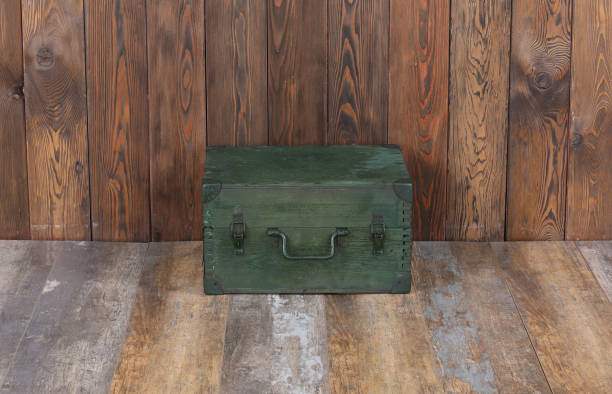 istock green military boxes on a wooden background 1280346905
