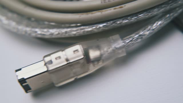 usb cable with plug for devices connection on white surface