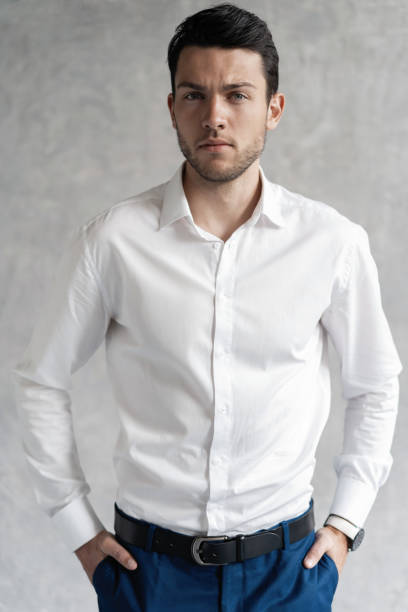 istock Handsome man wear blue suit isolated on grey background. 1280348235