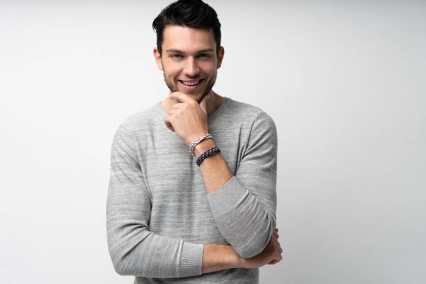istock Handsome young man on white background looking at camera. Happy guy smiling 1280348477