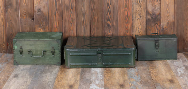 istock green military boxes on a wooden background 1280349068