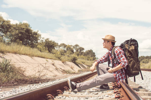 istock Asian man with backpack traveling in summer time 1280349093