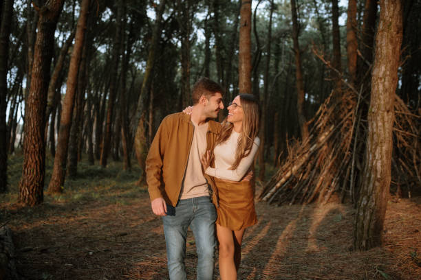 istock Young couple walking in a forest in autumn 1280350279