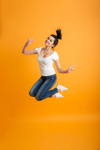 istock Cute young woman jumping 1280350657