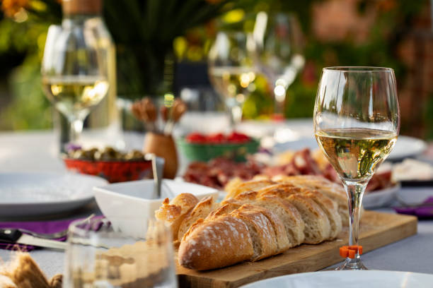 istock Set up table with white wine and appetizers 1280351553