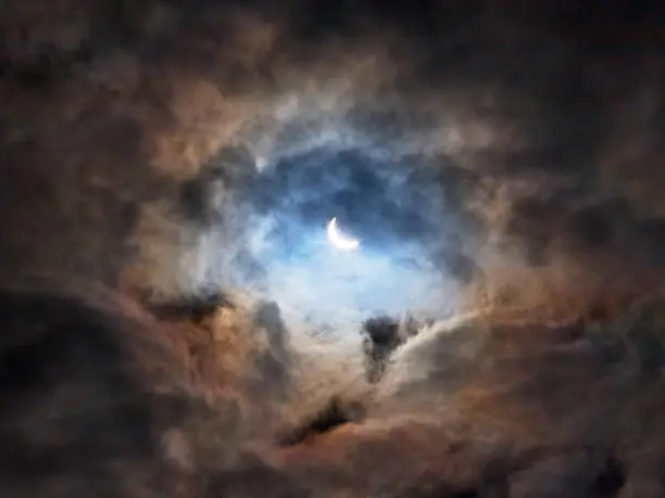 View up through the clouds to the solar eclipse on 20 March 2015 from Kelso in the Scottish Borders.