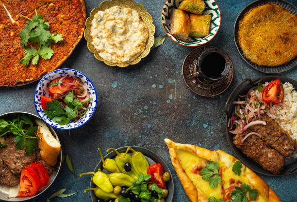 istock Traditional Turkish food, assorted dishes and mezze appetizers on rustic background from above. Pide, Lahmacun, meat kebab, Turkish meatballs, sweet baklava and KÃ¼nefe. Middle East cuisine, copy space 1280352811