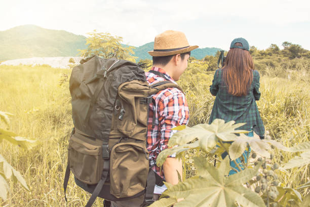 istock A couple with backpack is hiking 1280354693