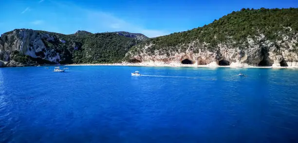 Photo of Ultra wide panorama of the beach and the coast line of Cala Luna