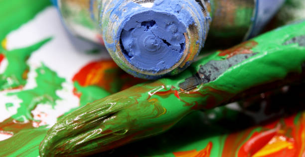 istock close-up colorful paint splashes with brush background 1280356713