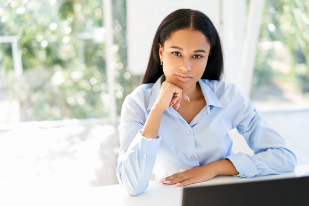 istock Confident pretty black businesswoman in modern office with copy space 1280357016