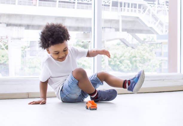 istock African boy playing in living room at home 1280358008