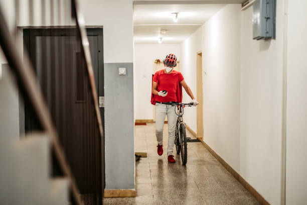istock Delivery man checking the right address on his smart phone 1280358033