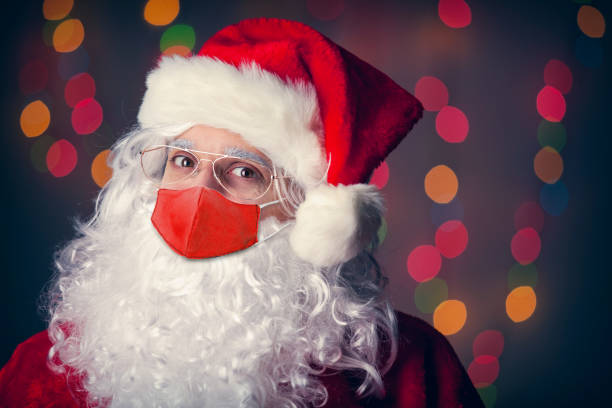istock Santa Claus in Covid-19 Face Mask 1280358505