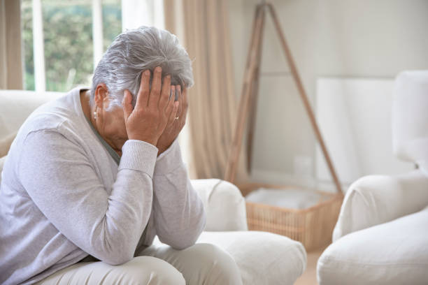 istock Depressed elderly woman at home 1280359187