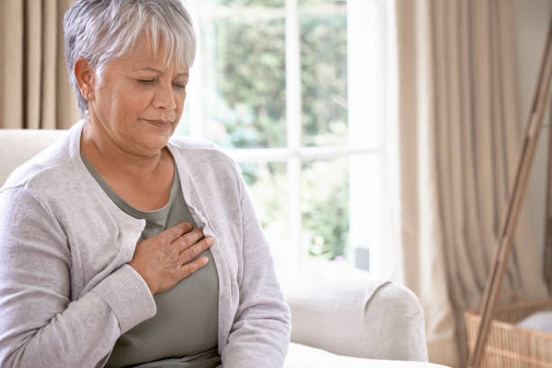 istock Sick coughing senior woman 1280359212