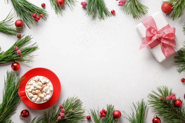 istock Christmas frame with gift, fir branches on white. Copy space. Xmas greeting card. 1280360351