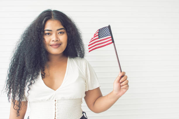 istock African woman holding american flag 1280360514
