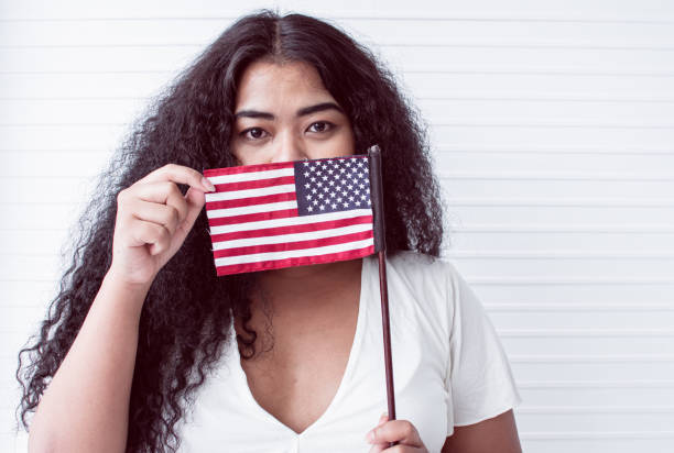 istock woman holding american flag 1280361703