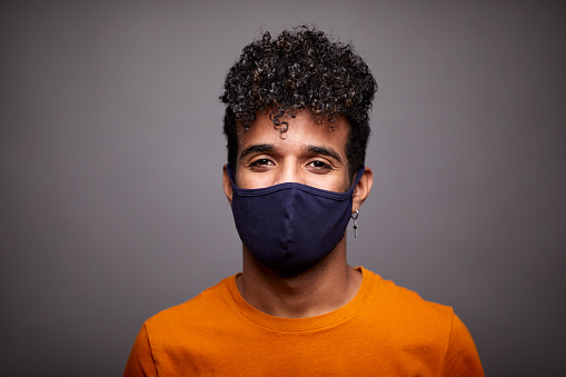 Studio headshot
Real people
Studio portrait of a young man wearing a cloth protective mask