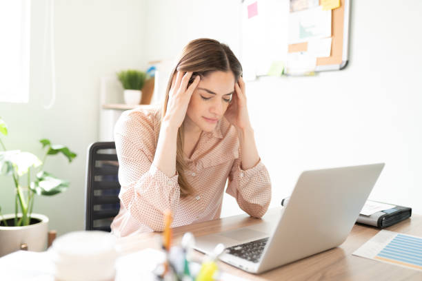 istock Stressed and overwhelmed woman at work 1280362647