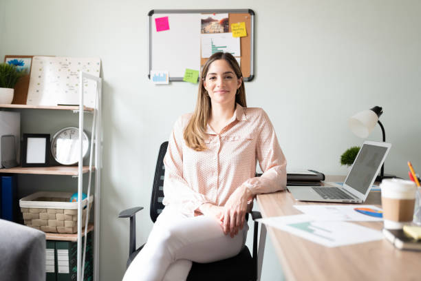 istock Pretty woman working in an office 1280362714