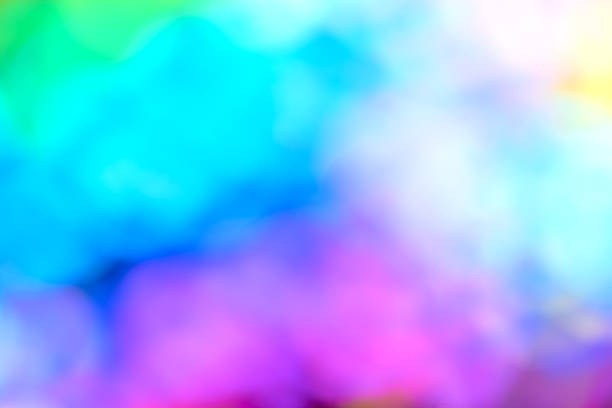 Multicolor blue and red blurred neon lights flares and rainbow glitter. Bokeh lens flare glow. Festive backdrop. Merry Christmas andd New Year fireworks. Overlay