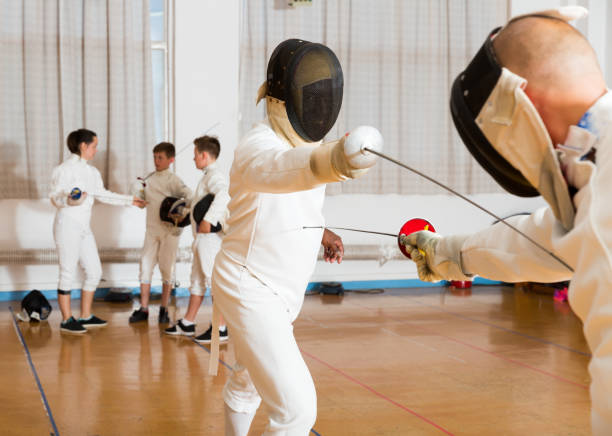 istock fencing duel  of two l athletes 1280363938