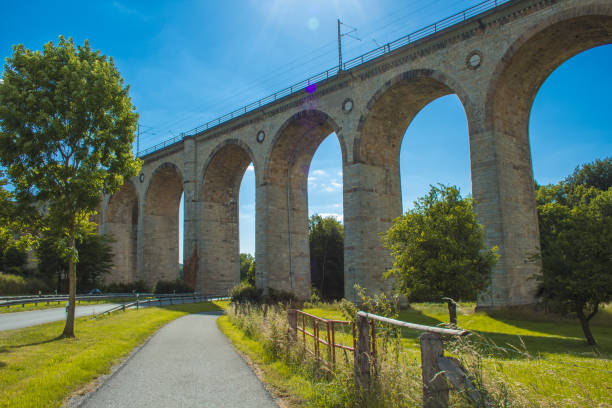 Train viaduct in Altenbeken, North Rhine Westphalia, Germany. Old stone railway surrounded by green park Train Viaduct in Germany paderborn stock pictures, royalty-free photos & images