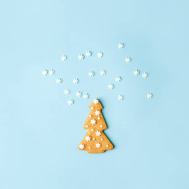 istock Happy New Year's Christmas card - traditional tree from ginger biscuits glazed sugar icing decoration on blue background, minimal stylish seasonal winter holiday card, banner, flyer, coupon invitation 1280366330