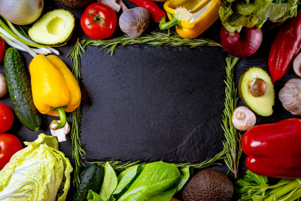 istock Many different fresh vegetables on a black background with free space for your text 1280367580