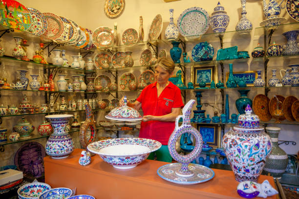 Senior Adult holding ceramics decor