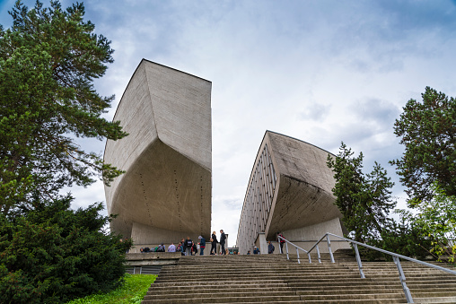 A group of tourists wait outside the Slovak National Uprising Museum in Banska Bystrica. This building was designed by architect Dusan Kuzma and completed in 1969. During the Second World War, Slovakia was a satellite country of the Nazi regime, until an insurrection of the resistance against the Germans in August 1949. This museum explores this important episode of Slovak history.