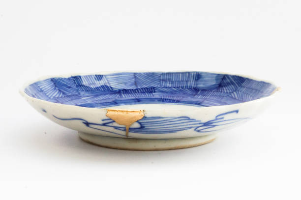 istock Kintsugi Antique broken Japanese plate repaired with gold. 1280370193