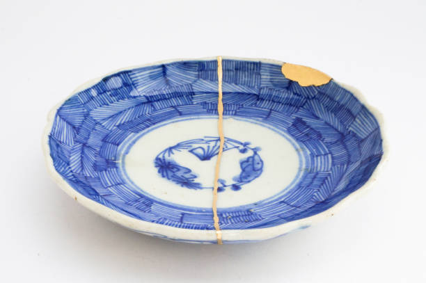 istock Kintsugi Antique broken Japanese plate repaired with gold. 1280370195