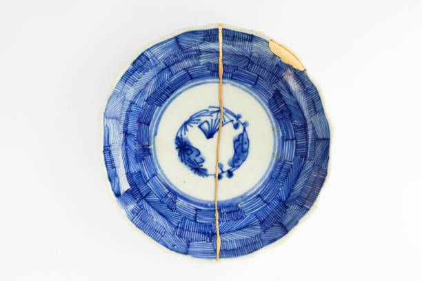 istock Kintsugi Antique broken Japanese plate repaired with gold. 1280370212
