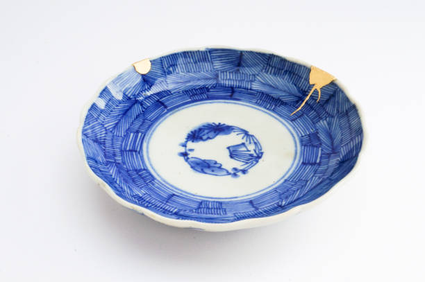 istock Kintsugi Antique broken Japanese plate repaired with gold. 1280370213