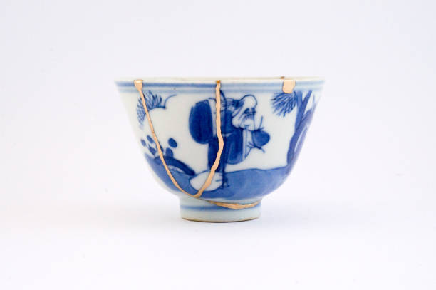 istock Kintsugi bowl Antique broken Japanese pottery repaired with gold. 1280370214