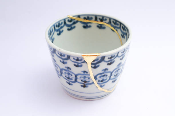 istock Kintsugi Antique broken Japanese cup repaired with gold. 1280370266