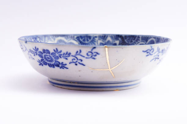 istock Kintsugi Antique broken Japanese plate repaired with gold. 1280370267