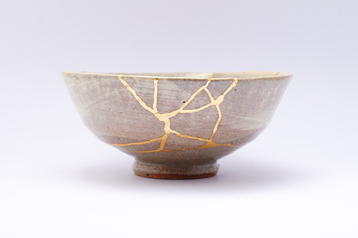 Kintsugi Antique broken Japanese bowl repaired with gold.