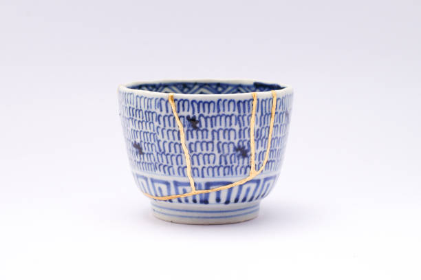 istock Kintsugi Antique broken Japanese cup repaired with gold. 1280370299