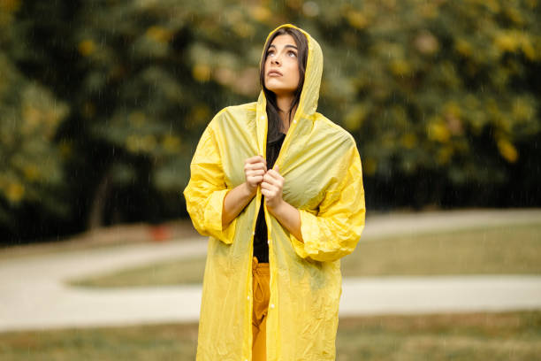 istock Depressed woman with problems walking in rainy day 1280370305
