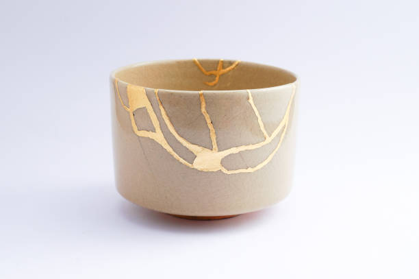 istock Kintsugi Antique broken Japanese bowl repaired with gold. 1280370316