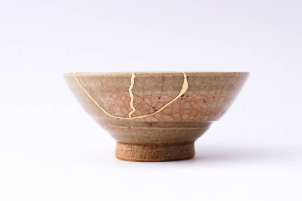 istock Kintsugi Antique broken Japanese bowl repaired with gold. 1280370374
