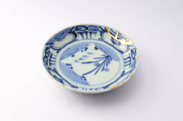 istock Kintsugi Antique broken Japanese plate repaired with gold. 1280370380