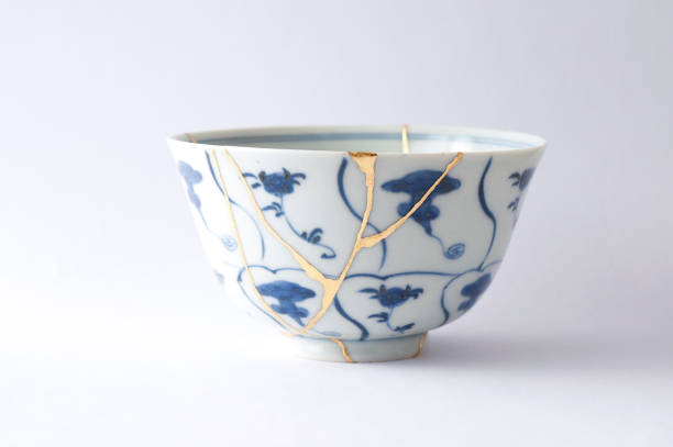 istock Antique broken Japanese bowl repaired with gold kintsugi technique 1280370435